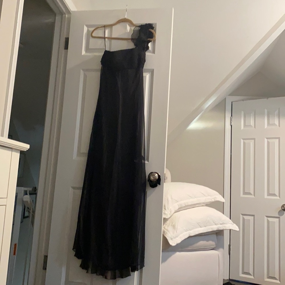 Amsale. Long black one shoulder dress.